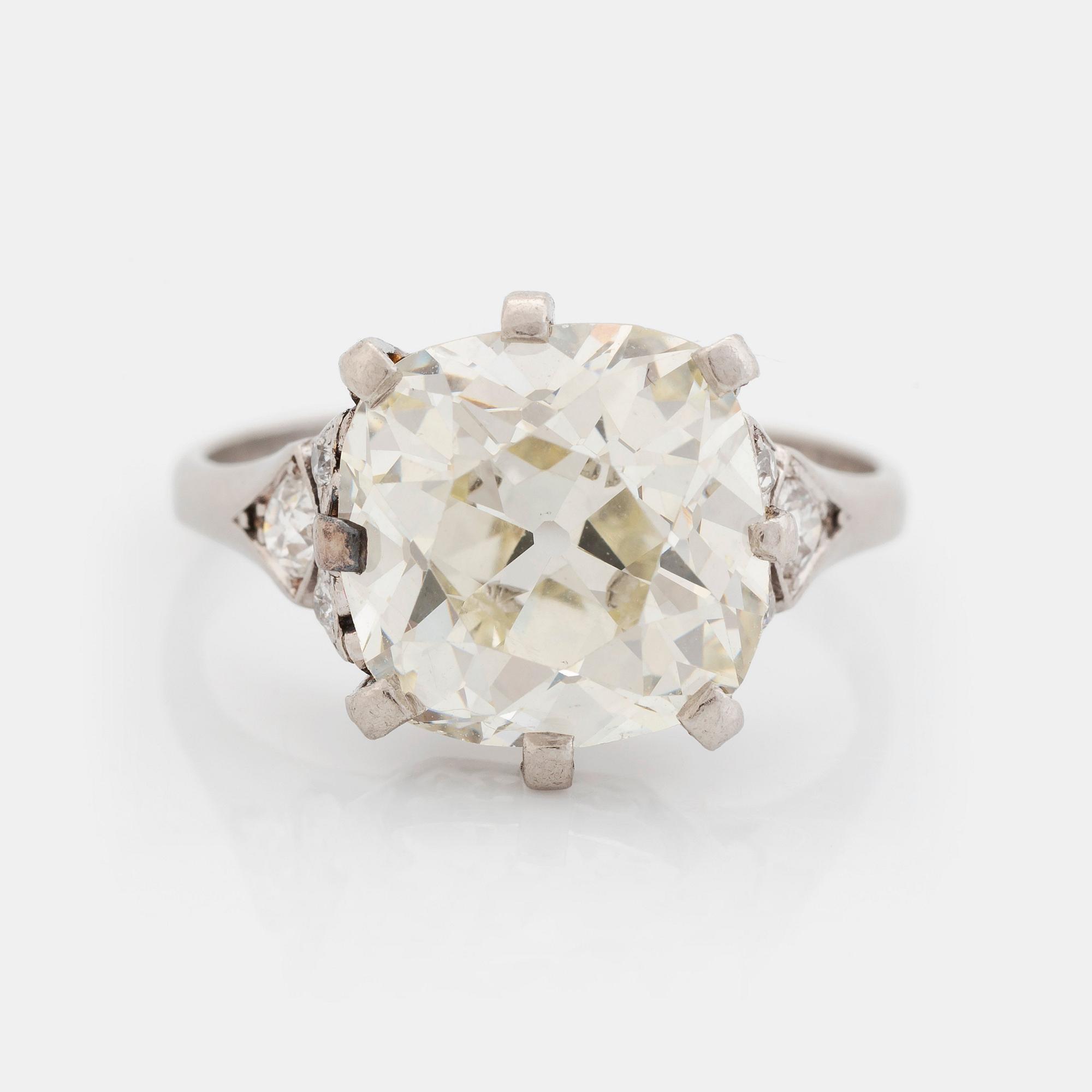 A platinum ring set with an old-cut diamond.