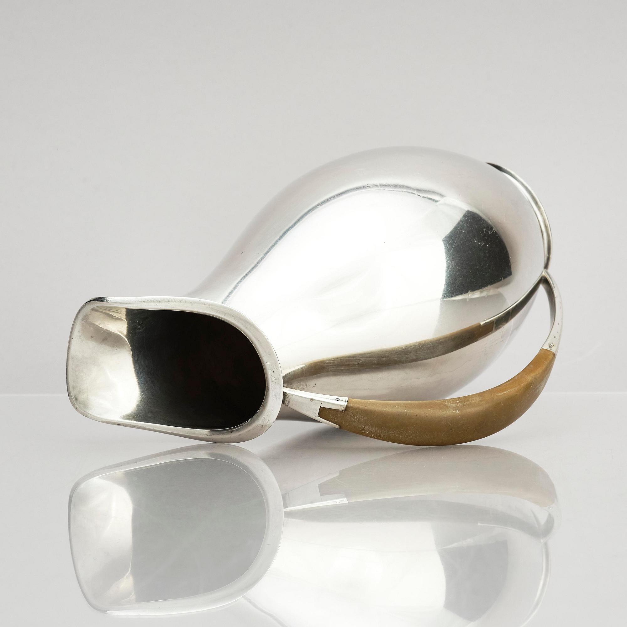 Anton F. Rasmussen, a silver water pitcher with bakelite handle, Aarhus, Denmark, cirka 1950s.
