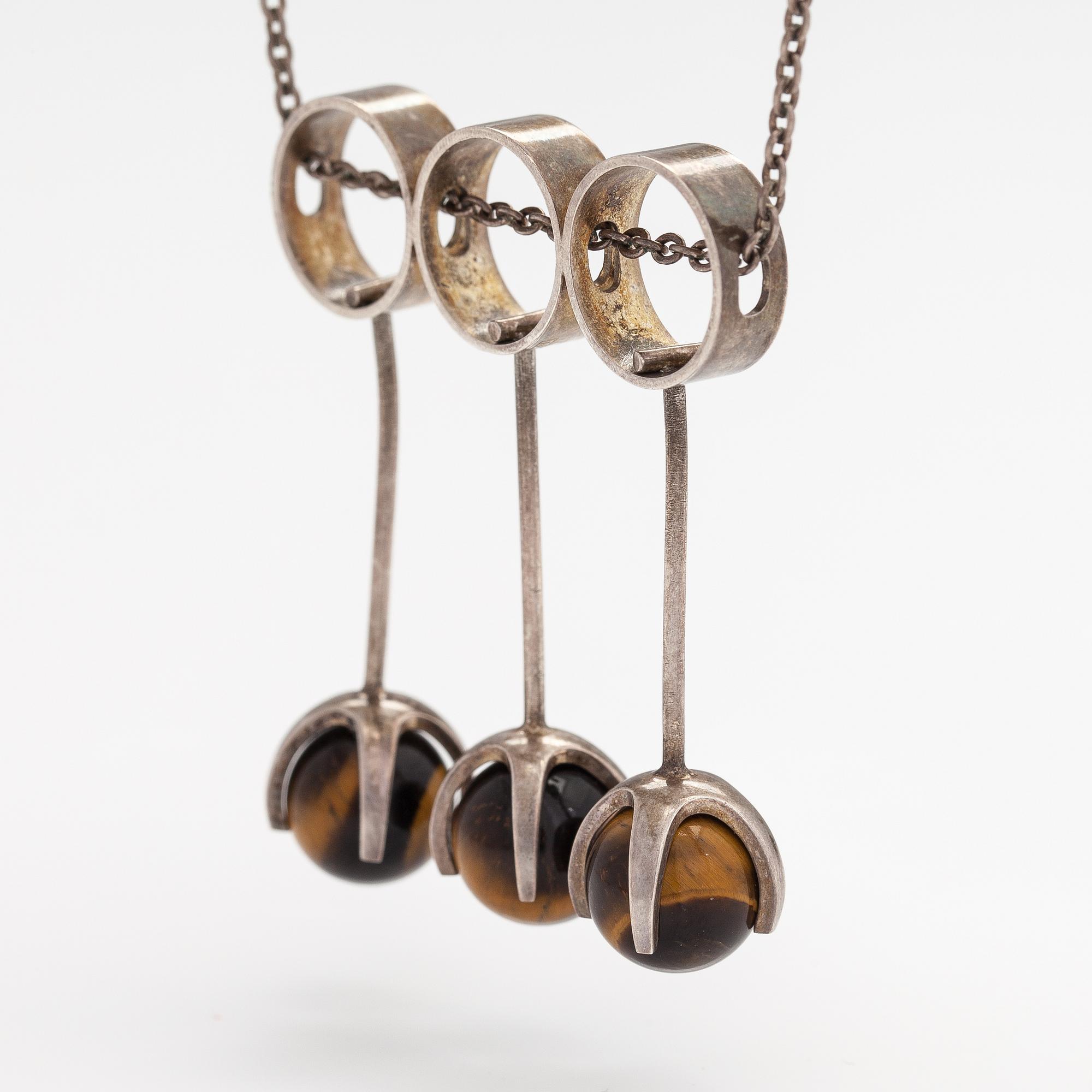 Elis Kauppi, A silver necklace with tiger's eye pearls. Kupittaan kulta, Turku 1965.