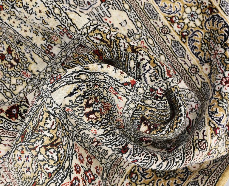 An Oriental silk rug, approx. 122 x 79 cm.