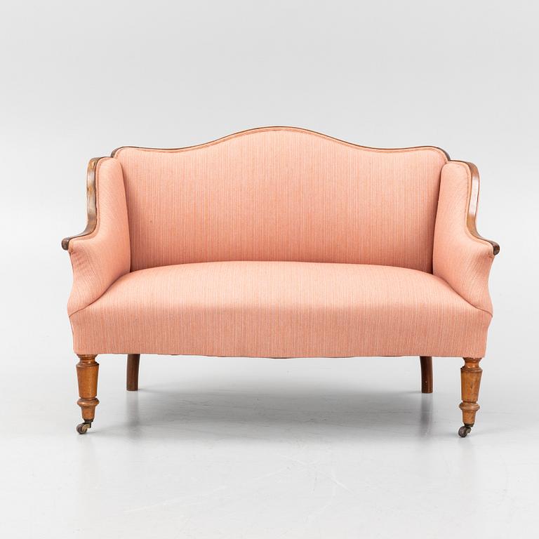 A stained beech sofa, late 19th Century.