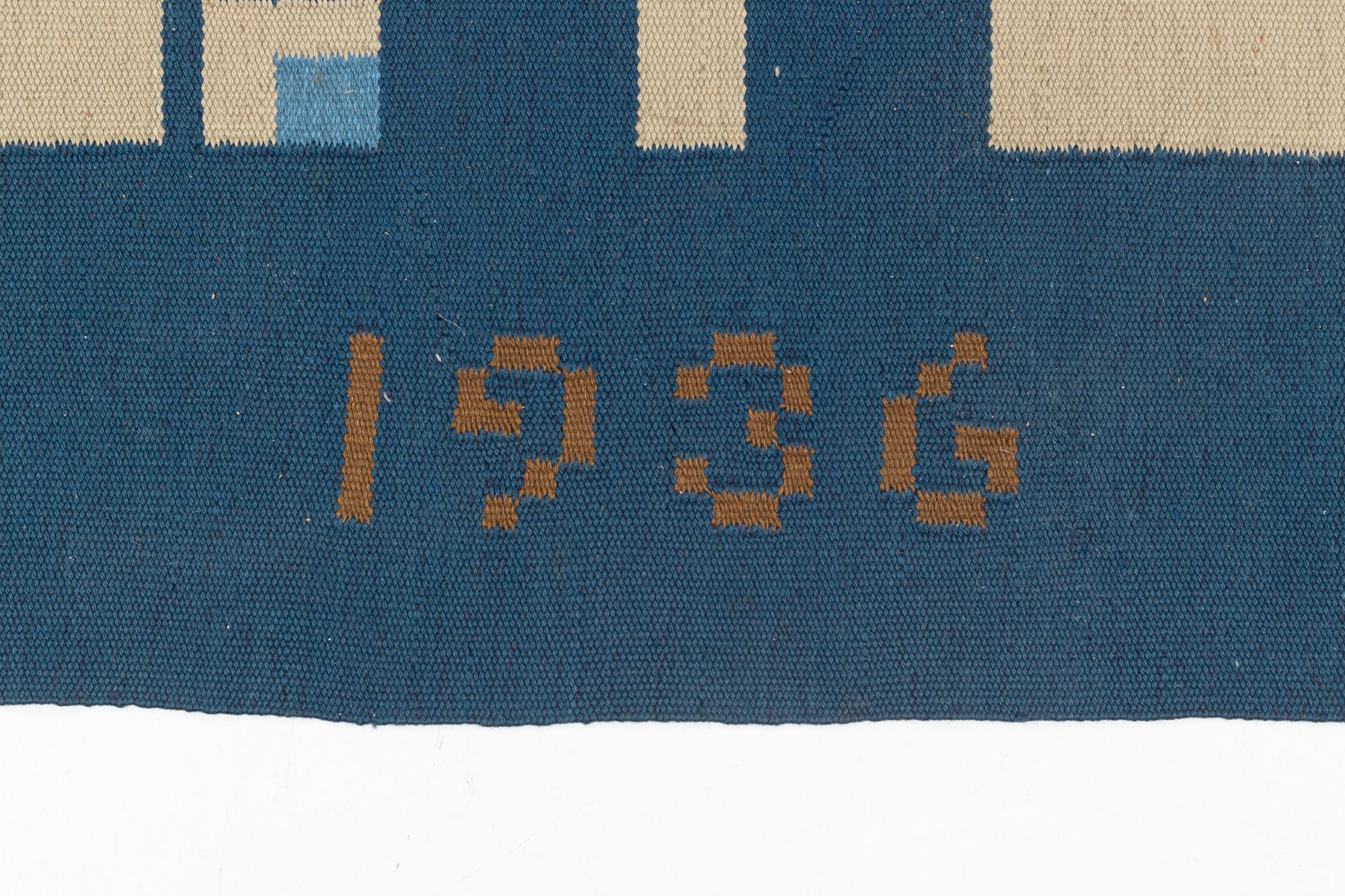 A flat weave carpet, Sweden, dated 1936, c. 370 x 260 cm.