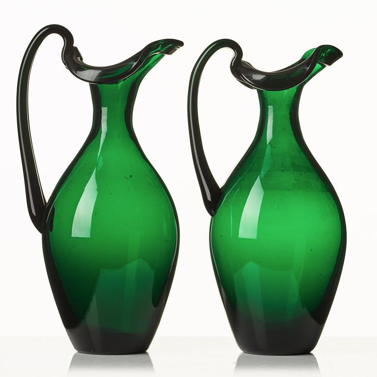 Edward Hald, two emerald green claret jugs, Sandvik's glassworks, Sweden ca 1929, model HS 1021.