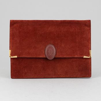 Cartier, a red suede clutch.