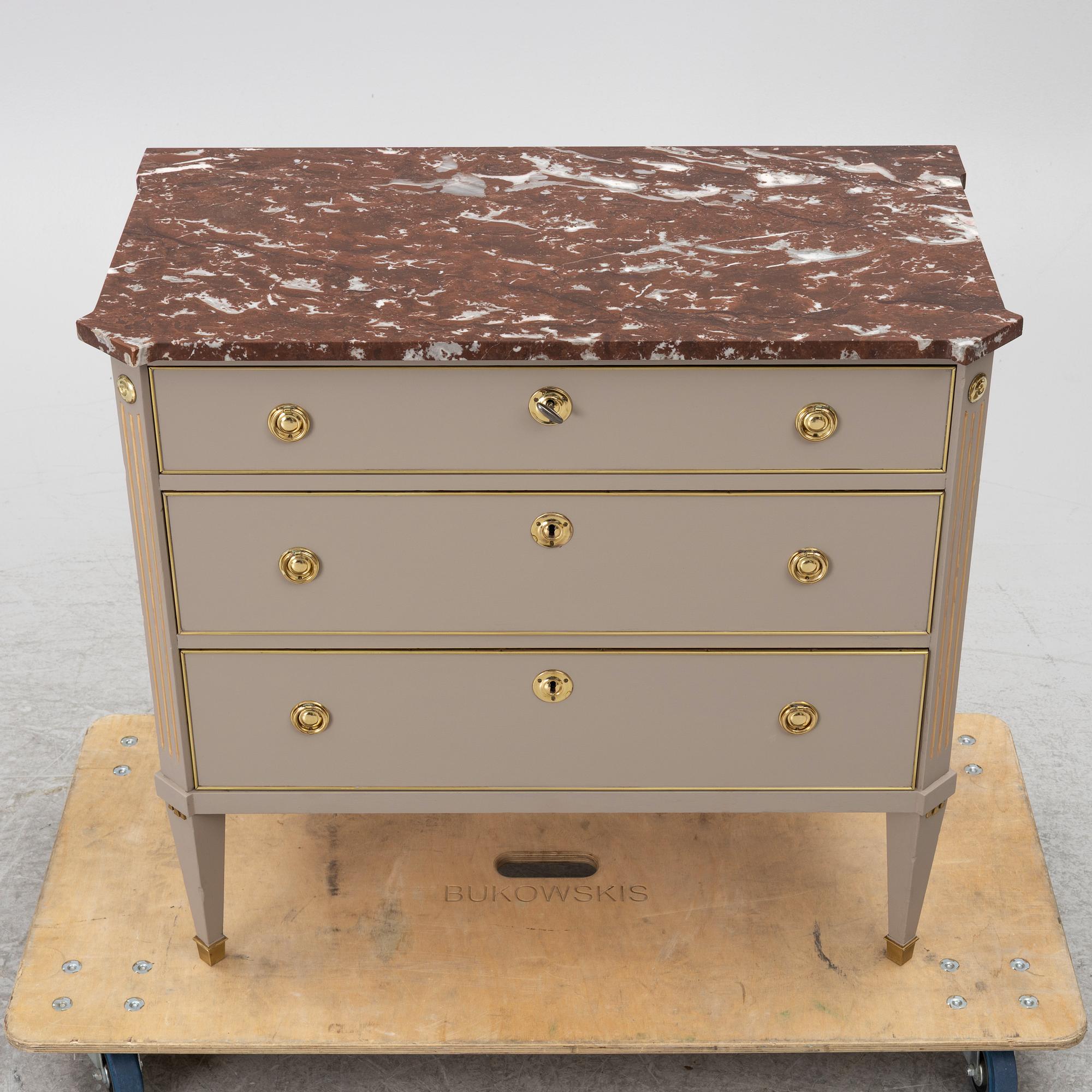 A Gustavian style chest of drawers, Mid 20th Century.