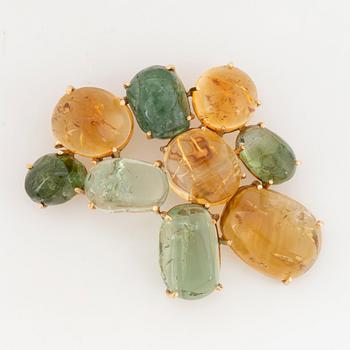 Cabochon-cut citrine and green tourmaline brooch.