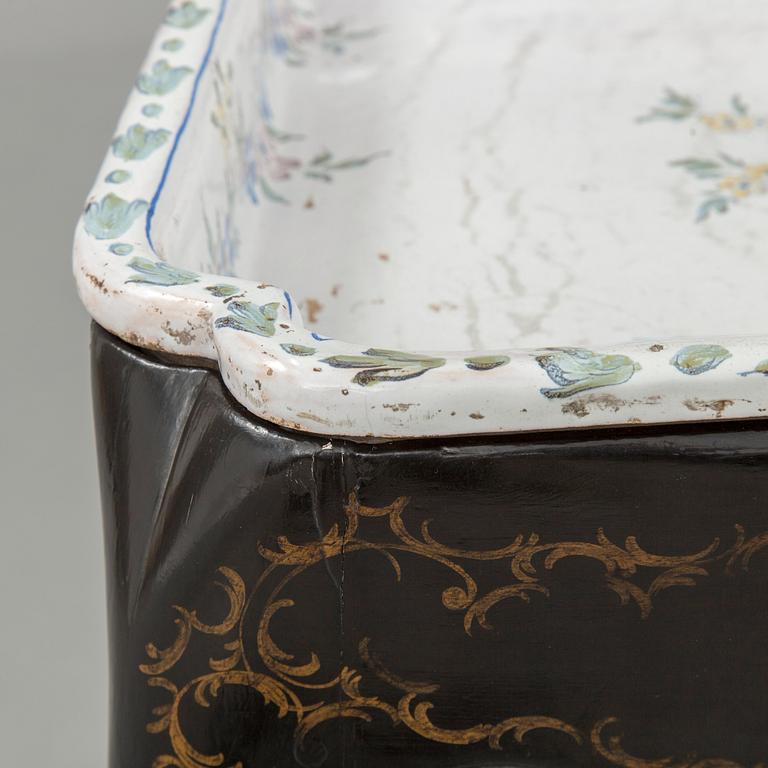 A Swedish Rococo faience tea table, Marieberg 1770.
