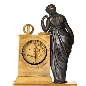 A French Empire early 19th century mantel clock, by Antoine André Ravrio.