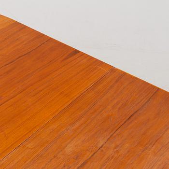 A 1950's/60's teak-veneered dining table.