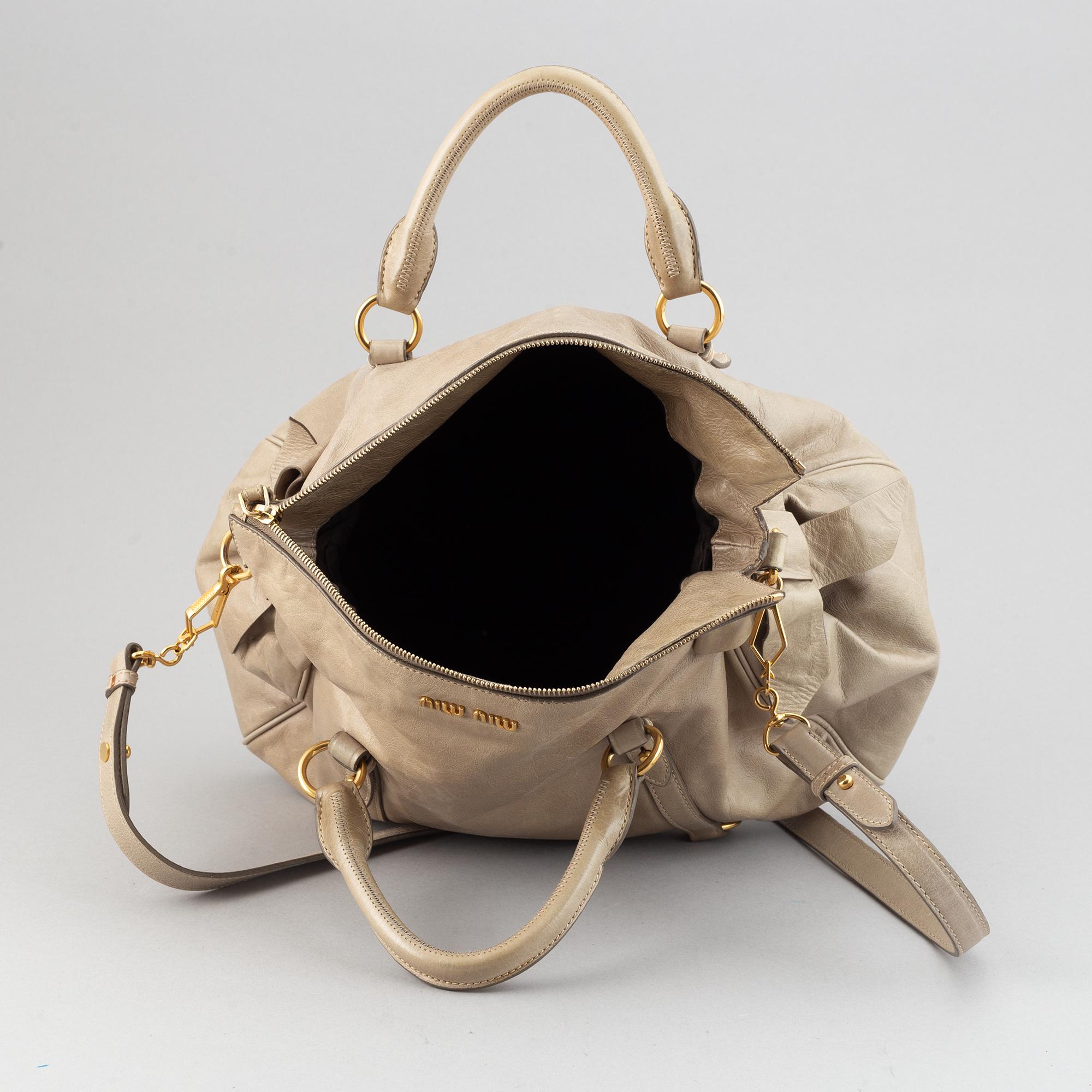 Miu Miu, a leather handbag.