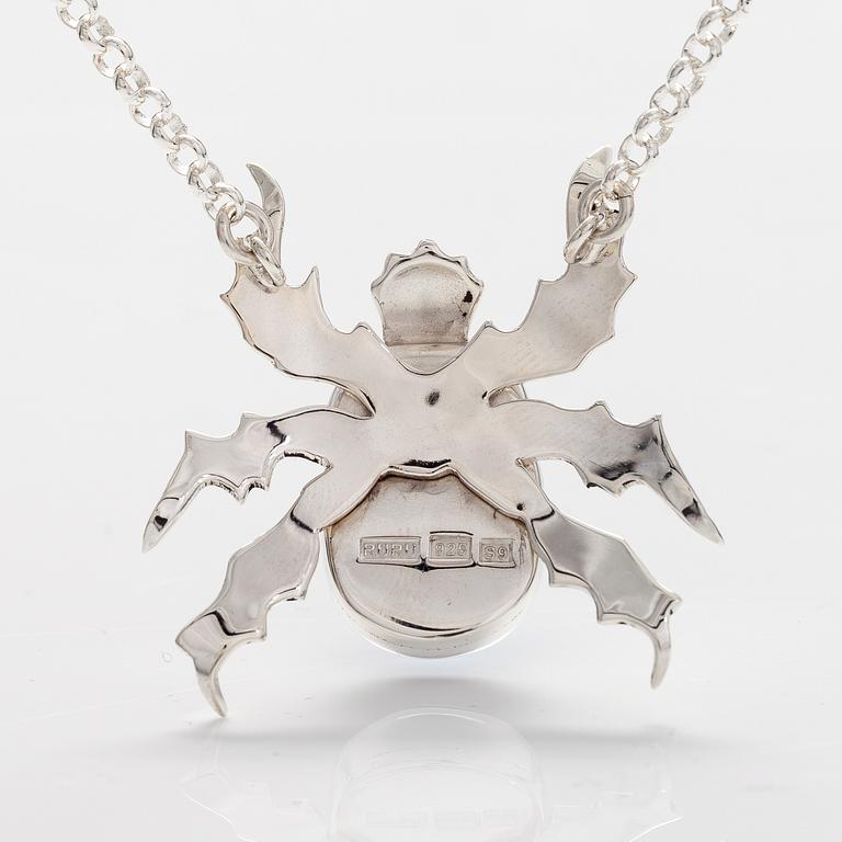 A stelring silver necklace "Scarab" with dichroic glass. Ru Runeberg 2019.