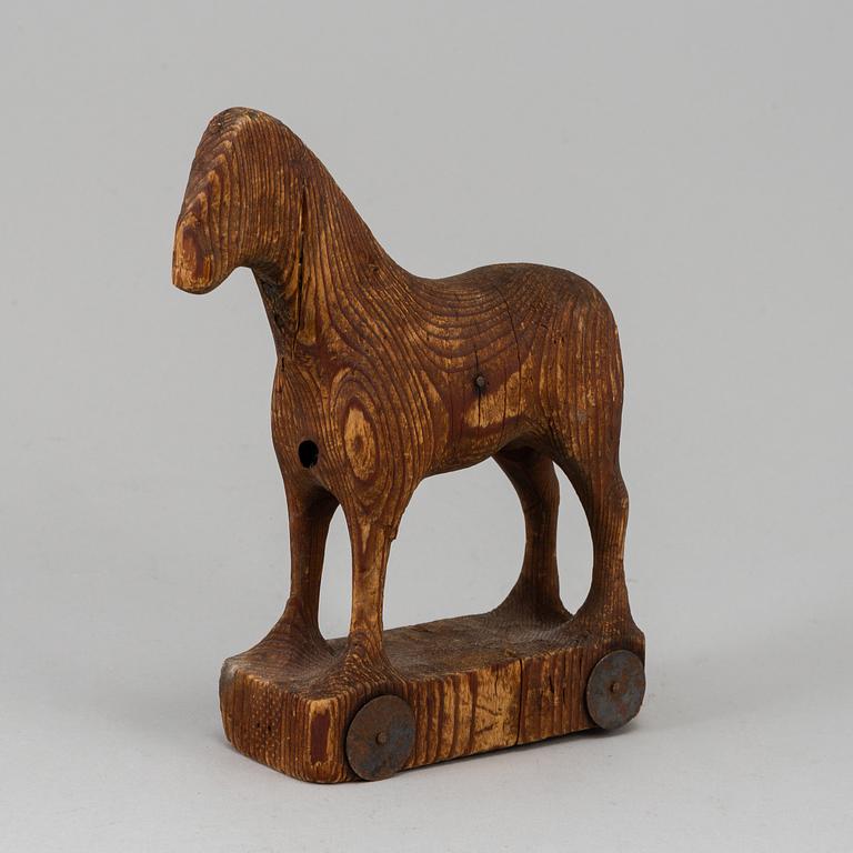 A wooden toy horse, marked Berglinds Leksaksfabr, Nyköping, early 20th century.