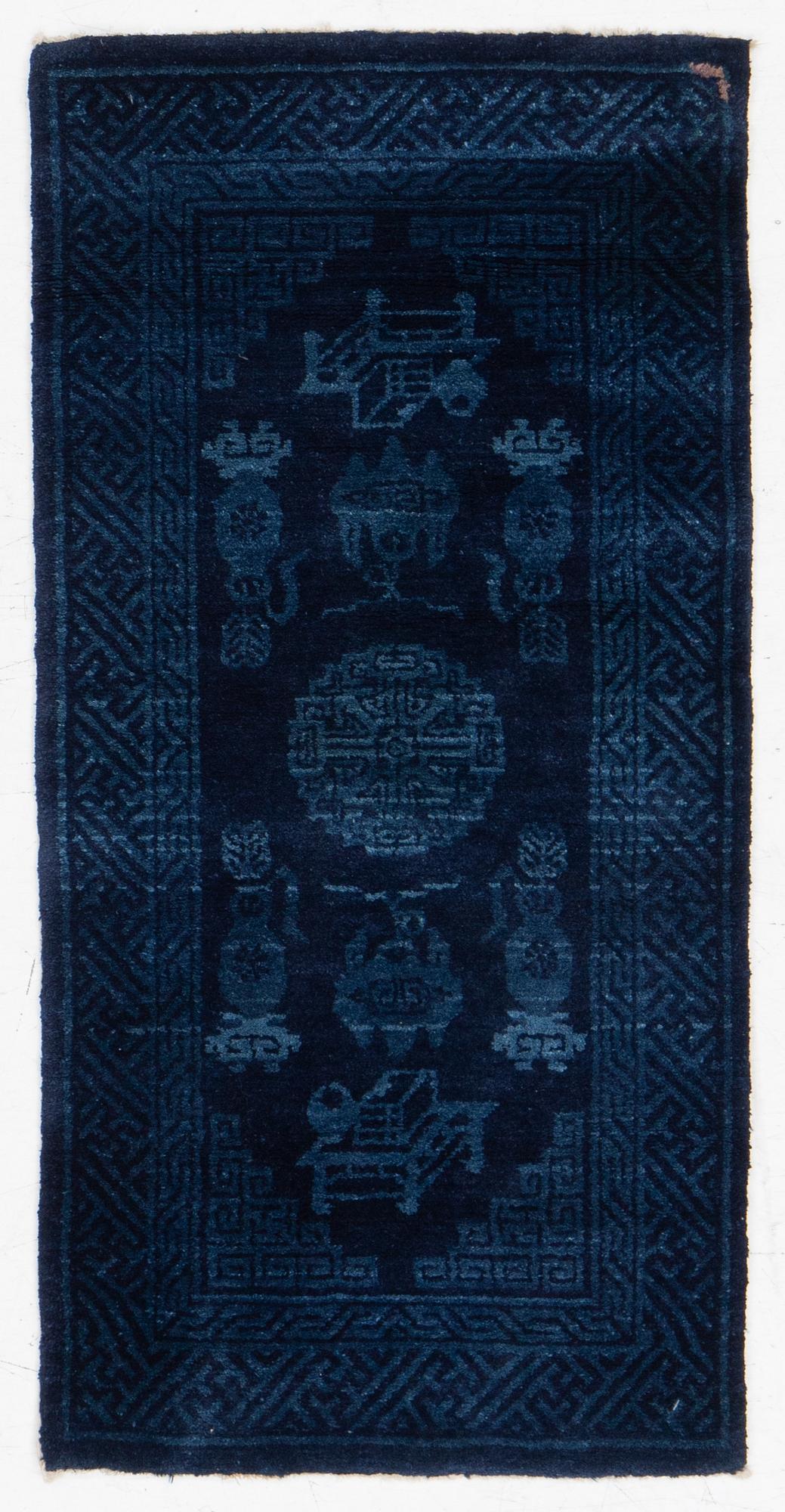 An antique Baotou, rug north China, c. 140 x 70 cm.