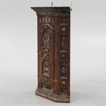 A Swedish painted corner cupboard, 18th Century.