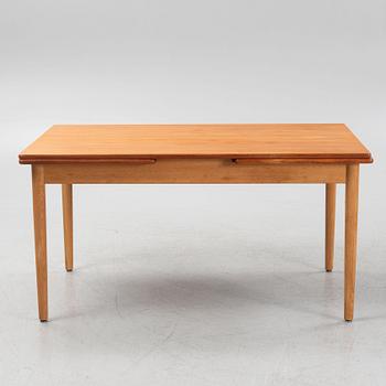 Hans J. Wegner, an oak and teak dinner table for Andreas Tuck. Denmark.