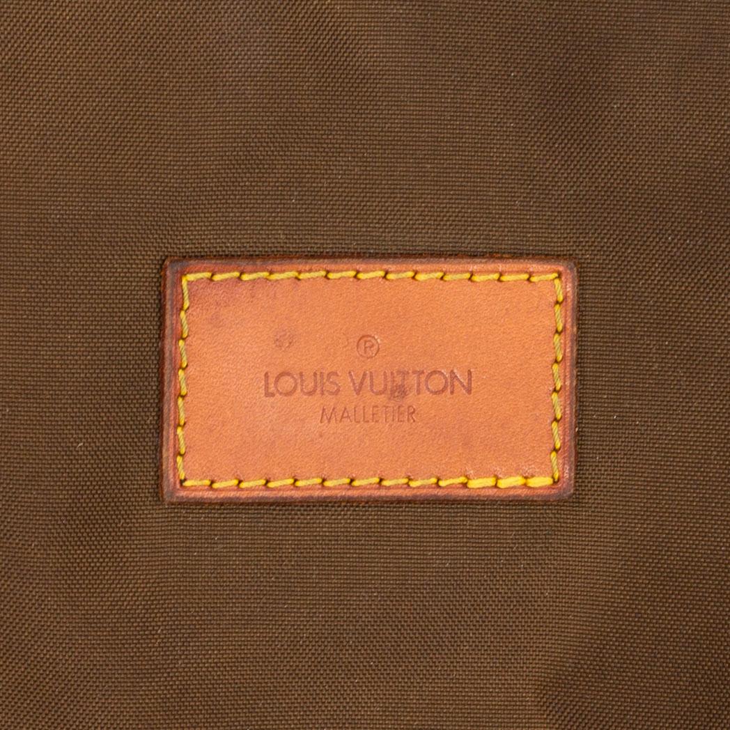 LOUIS VUITTON, a monogram canvas garment bag.