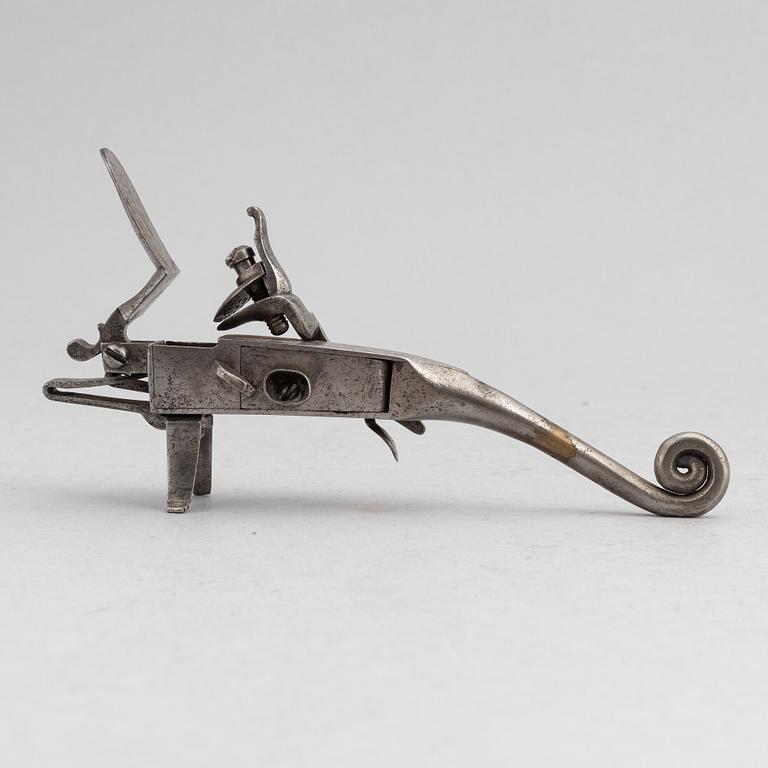 An 18th Century flintlock tinder lighter.