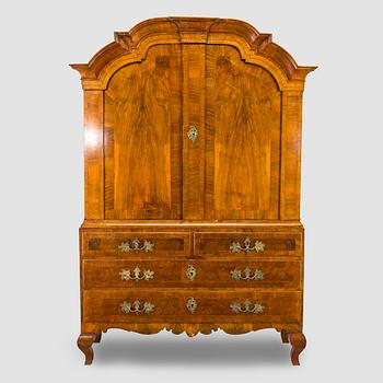 A Swedish walnut-veneered rococo cabinet in the manner of C. Linning, latter half of the 18th Century.