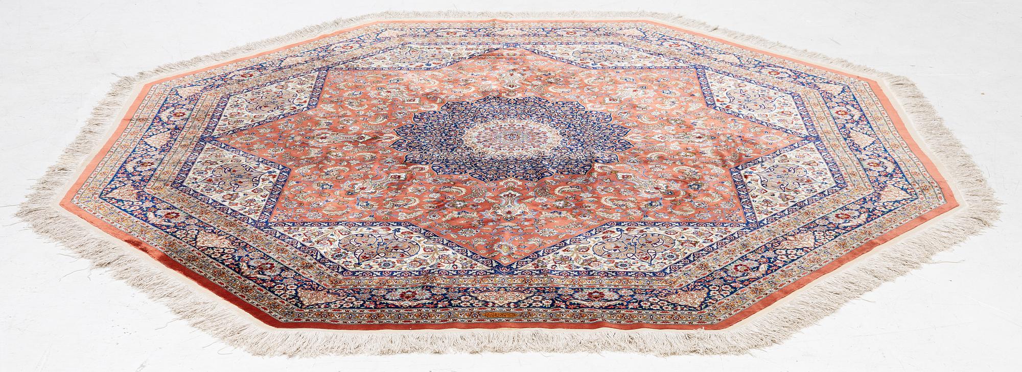 An Oktagonal  silk Qum rug, Central Persia, signed, c. 250 x 250 cm.
