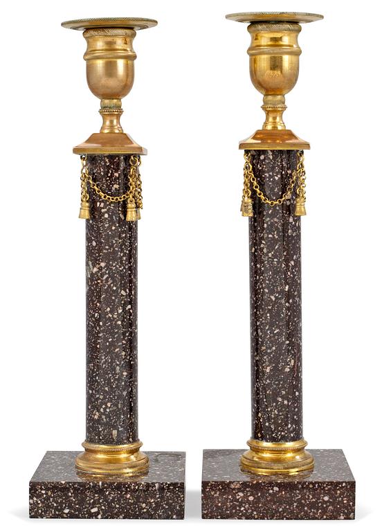A pair of late Gustavian circa 1800 porphyry candlesticks.