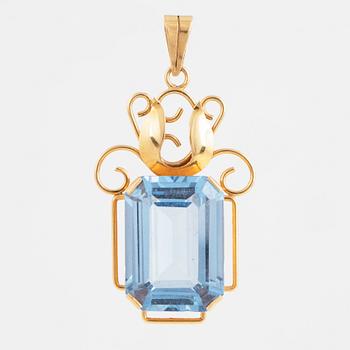 Blue synthetic spinel and 18K gold pendant.