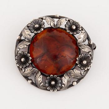 An NE From silver and amber brooch.