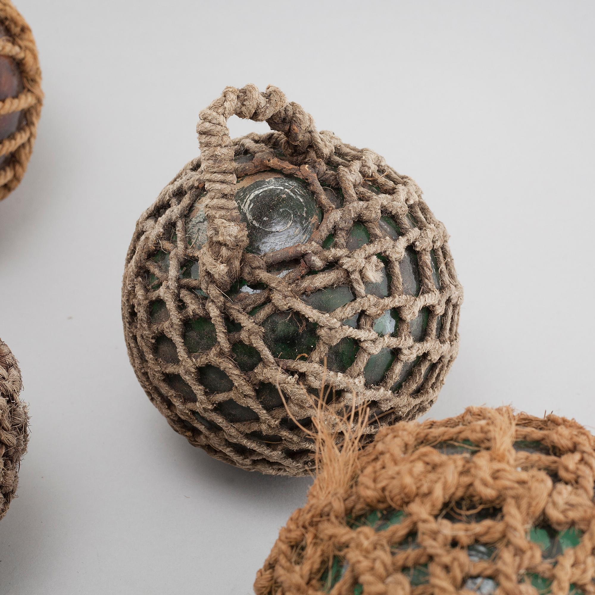 Ten 20th century glass floats.