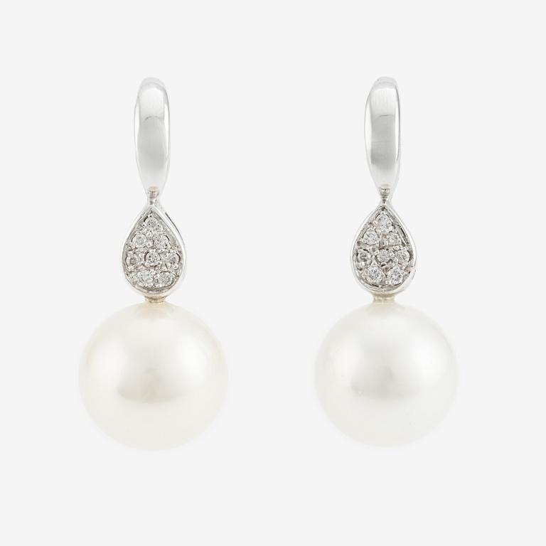 A pair of cultured pearl and brilliant cut diamond earrings.