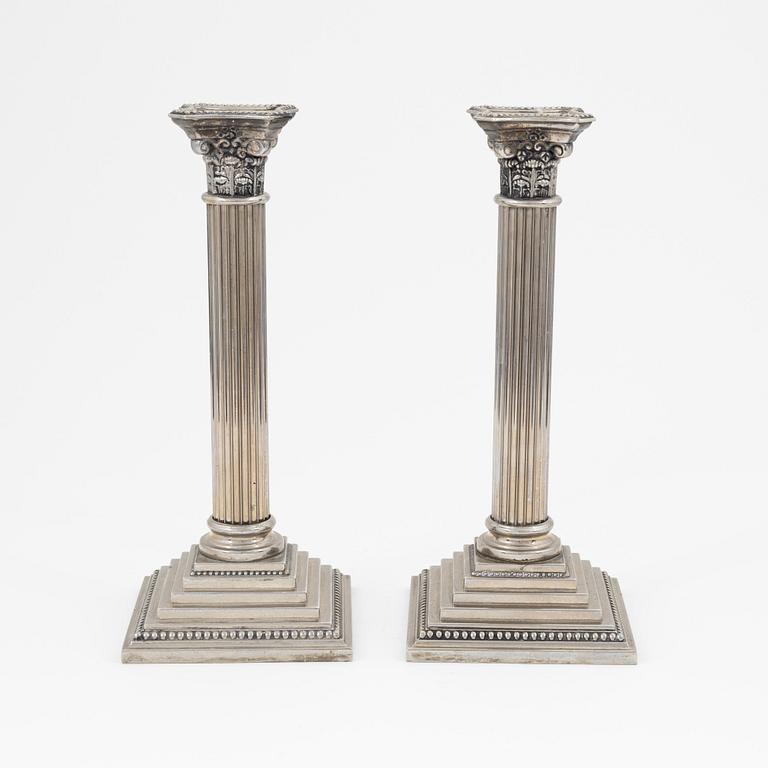 A pair of silver plate Godinger Silver candle holders, 1992.