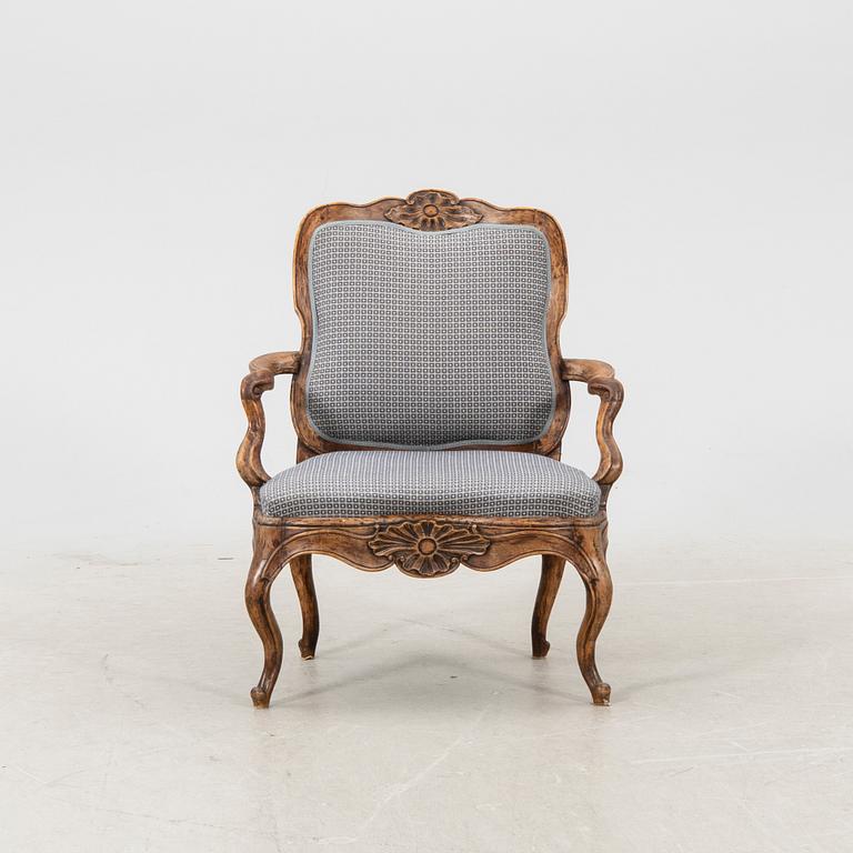 A mid 1700s Rococo armchair.