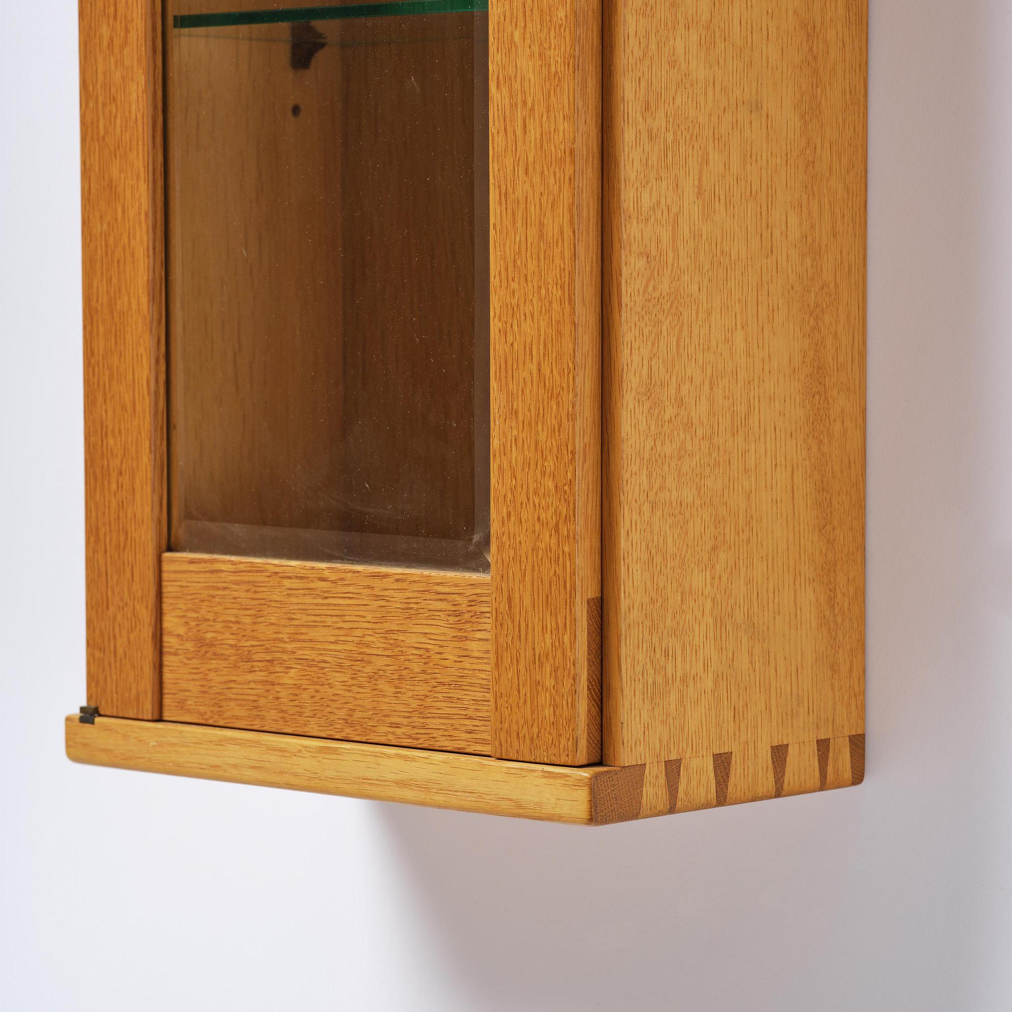 James Krenov, an oak or doussie showcase wall cabinet, executed in his own workshop, Bromma, Sweden.
