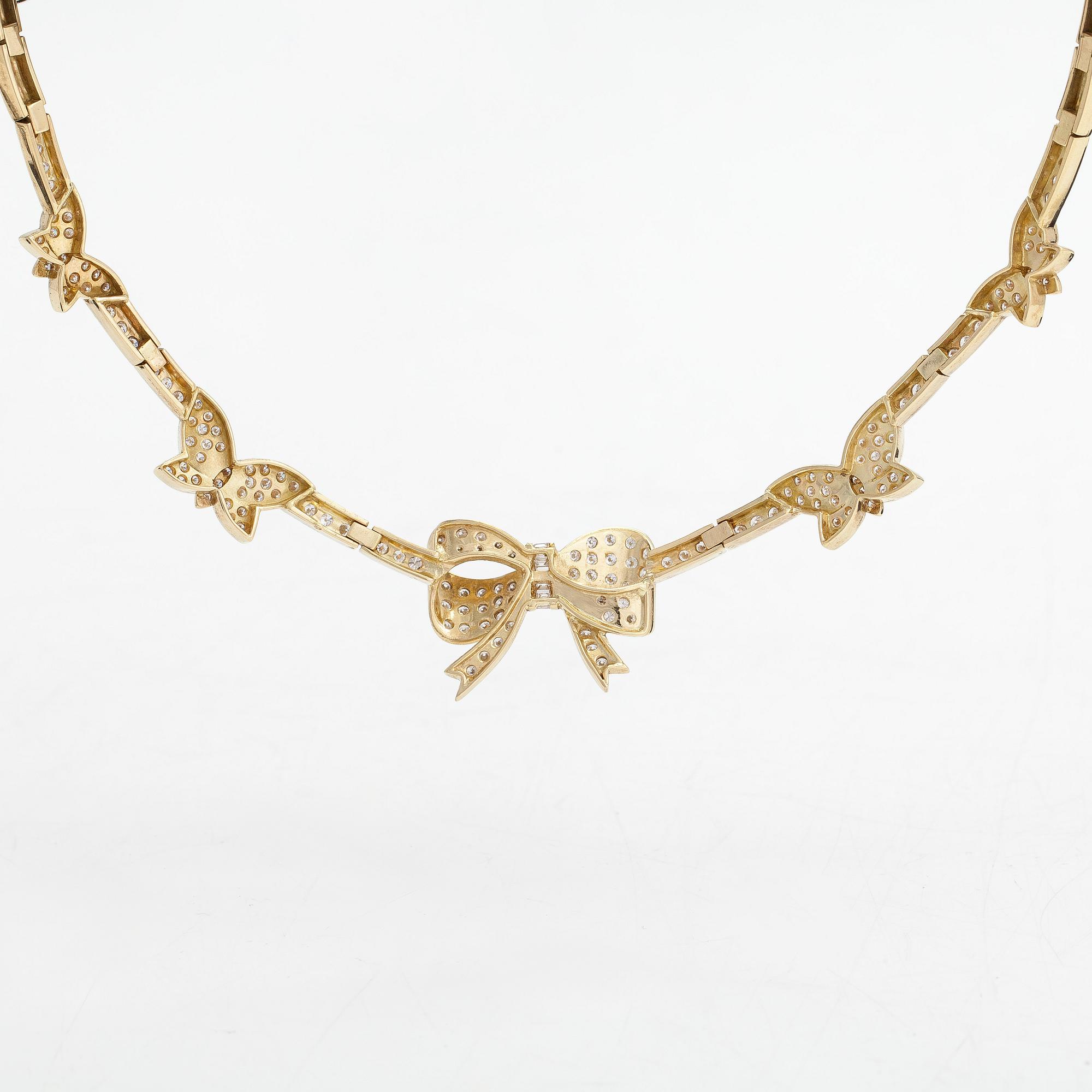 An 18K gold necklace, with brilliant- and baguette-cut diamonds totaling approx. 4.44 ct.