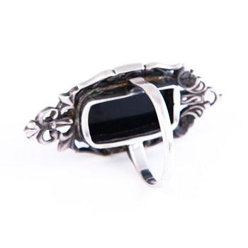 Four Art deco jewelry, ring, pendant necklace and earrings in silver.