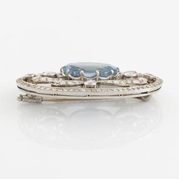 A WA Bolin brooch in platinum set with a faceted sapphire and old- and eight-cut diamonds.