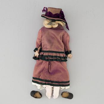 An early 20th cnetury porcelin doll, probably Germany.