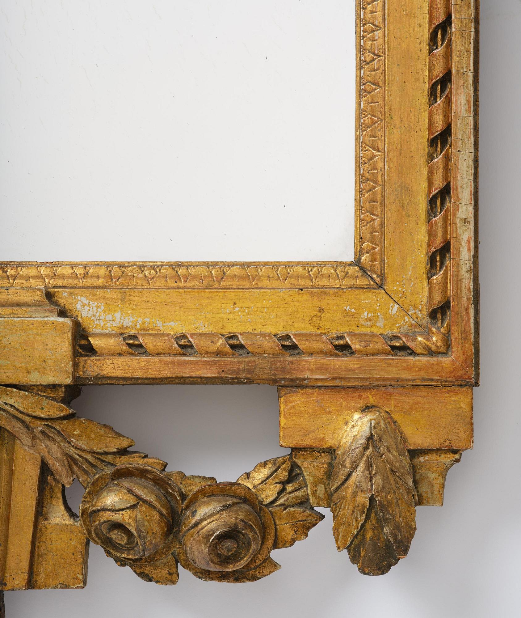 A Gustavian giltwood mirror by C. G. Fyrwald (master in Stockholm 1776-1825).