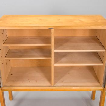 Alvar Aalto, mid-20th century '810' cabinet and a 
'69'chair Oy Huonekalu- ja Rakennustyötehdas Ab.