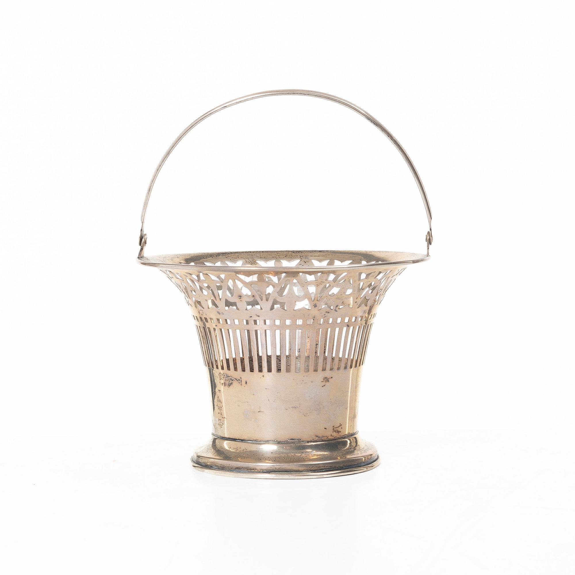 A sterling silver bowl with handle, signed with monogram CMM, 20th century.