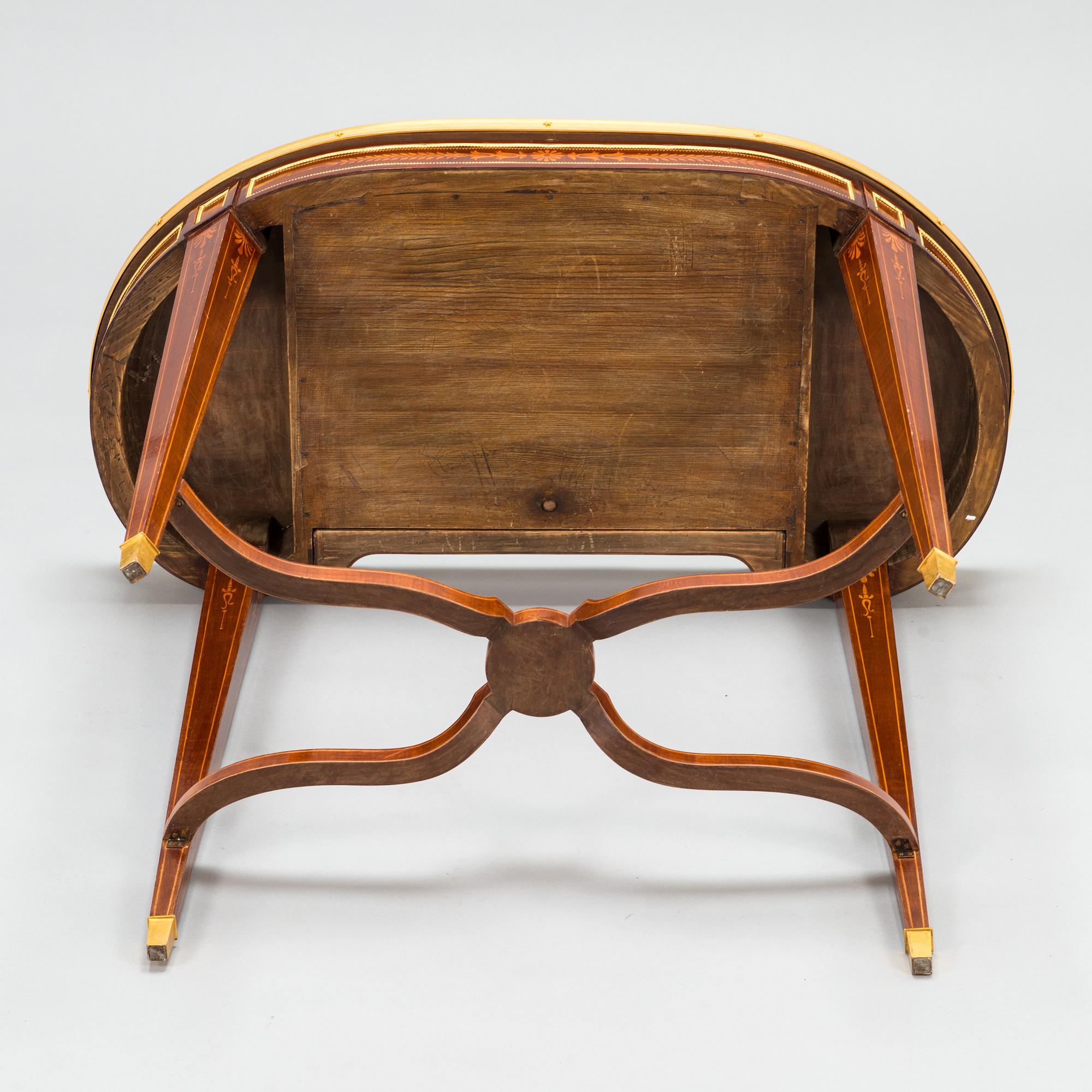 A Directoire style marquetry table from around year 1900.