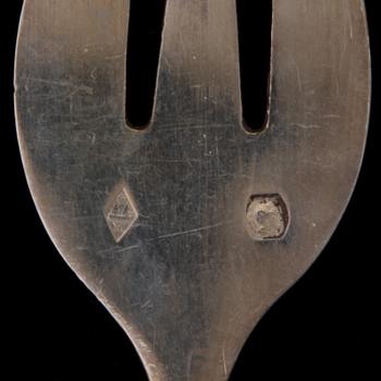 A SET OF TEN 19TH CENTURY FRENCH SILVER OYSTER FORKS, marked Charles Marseille, Paris.