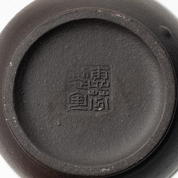 A group of three yixing teapots and a box with cover, China, 1970/80s.