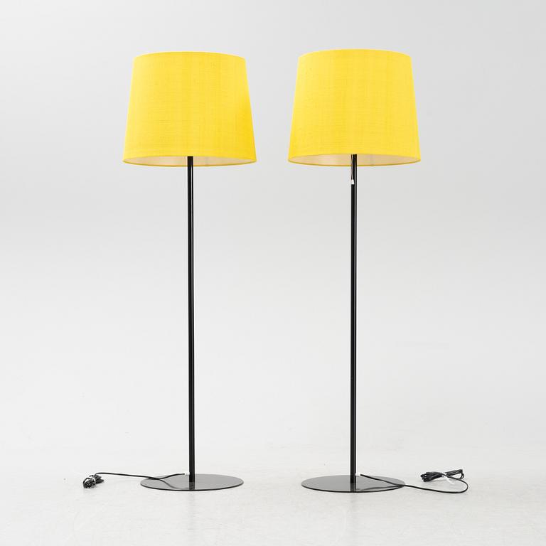 A pair of black metal floorlights, Luxus, Vittsjö.