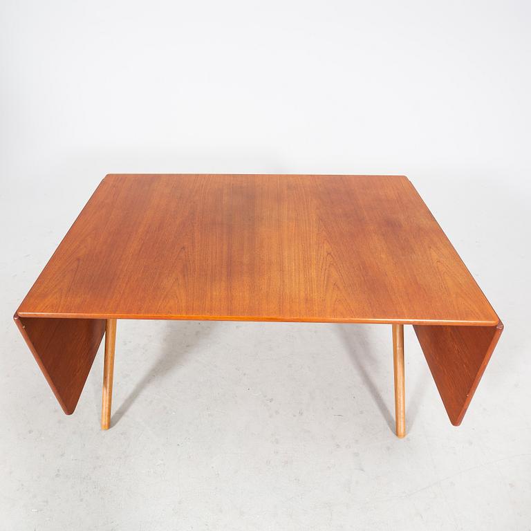 A Hans J Wegner "Savbukkebordet AT-303", teak and oak drop-leaf dining table, Andreas Tuck, Denmark 1950s-1960s.