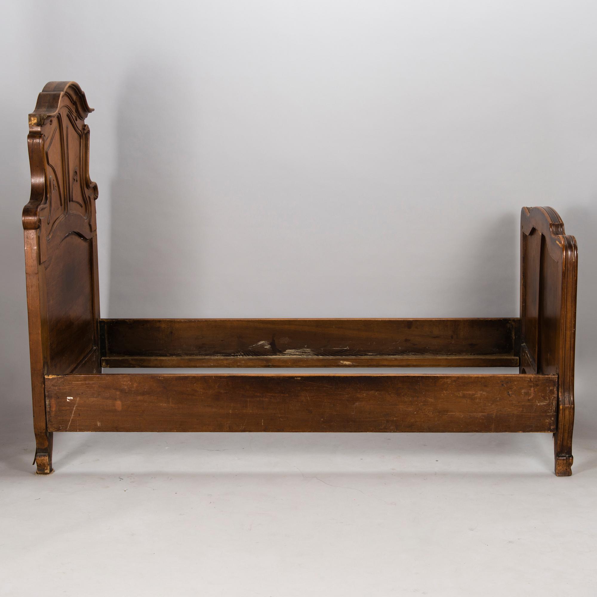 A pair of early 20th Century art nouveau style beds.