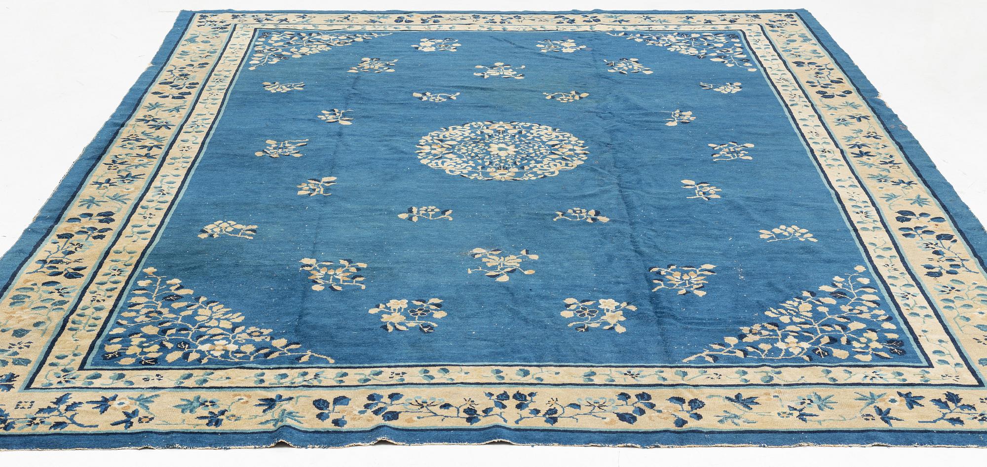 An antique Chinese carpet, c. 355 x 270 cm.