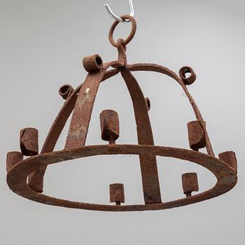 An 18th century iron ceiling light.