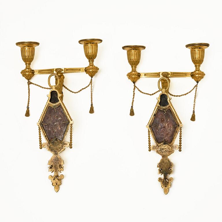 A pair of two-branch late Louis XVI ormolu and blued steel appliques attr. to F. Rémond (bronzier in Paris 1774-1812).