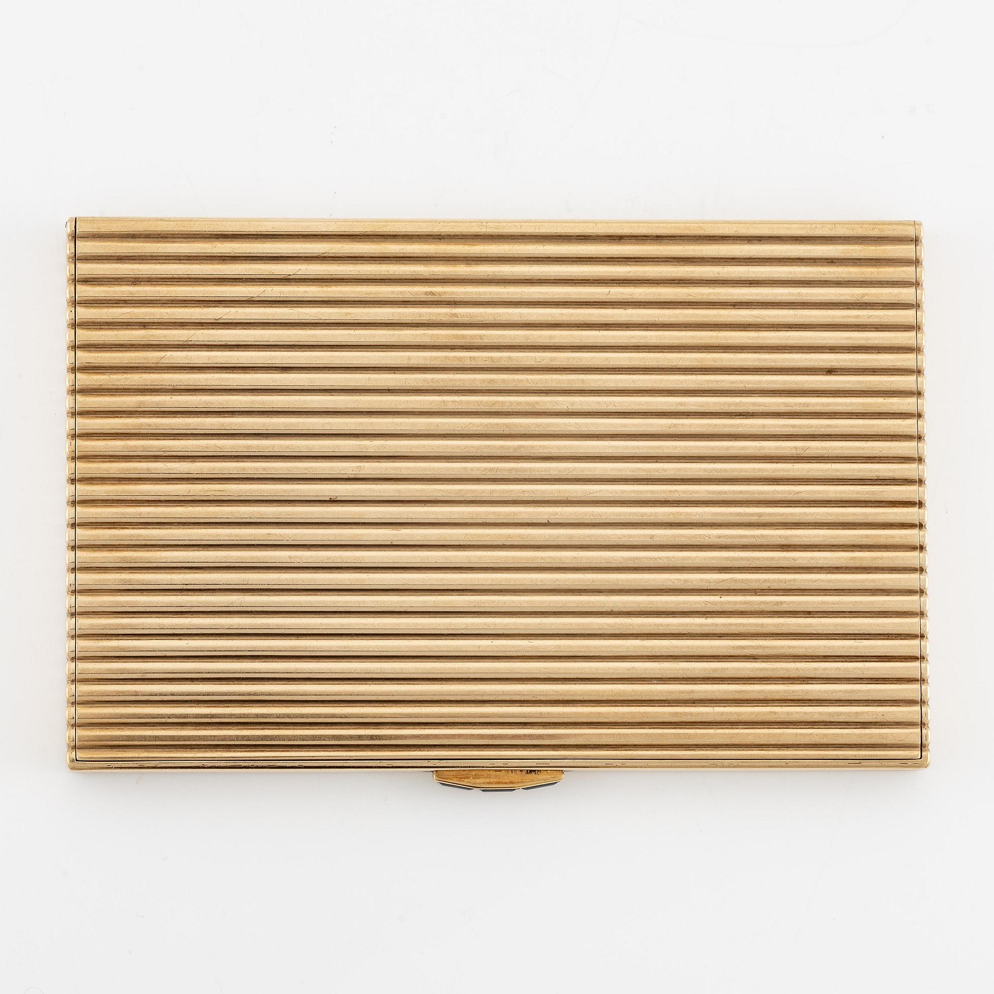 A Cartier 9 carat gold and calibré-cut sapphires cigarette case, London.