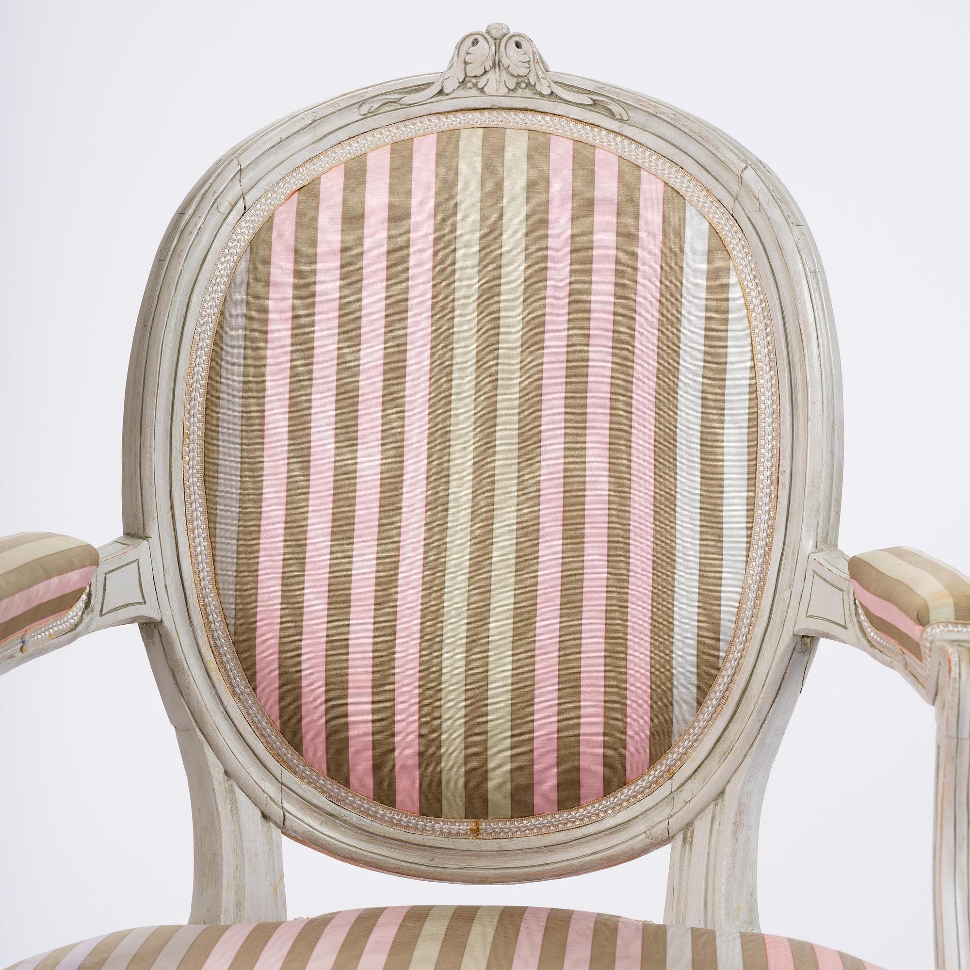 A pair of Gustavian open armchairs by E. Öhrmark (master in Stockholm 1777-1813).