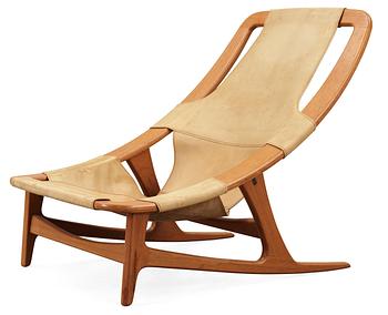 74. An Arne Tidemand Ruud teak and leather easy chair, by Norcraft,